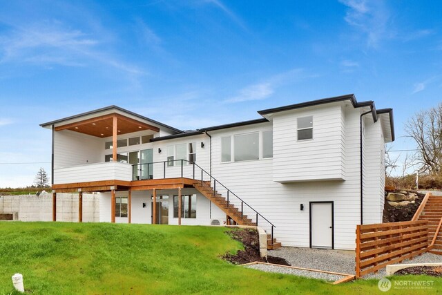 8721 Semiahmoo Dr, Blaine, WA 98230 - back of house with stairway, a deck, a yard, and fence