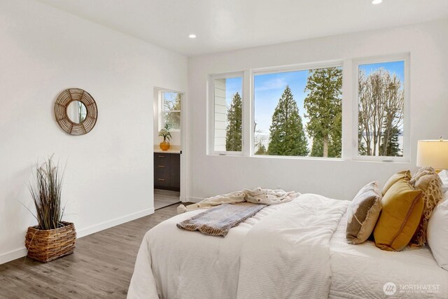 8721 Semiahmoo Dr, Blaine, WA 98230 - bedroom featuring baseboards, recessed lighting, ensuite bathroom, and wood finished floors