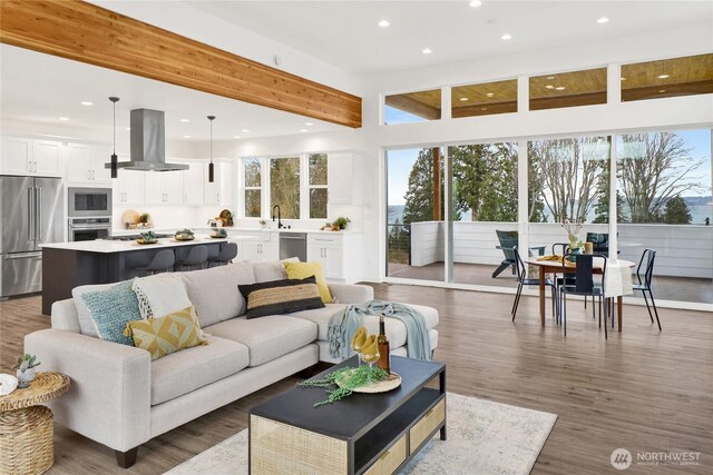 8721 Semiahmoo Dr, Blaine, WA 98230 - living area featuring recessed lighting, beam ceiling, and a healthy amount of sunlight