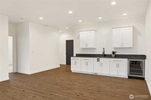 8721 Semiahmoo Dr, Blaine, WA 98230 - bar with wine cooler, baseboards, recessed lighting, and dark wood-type flooring