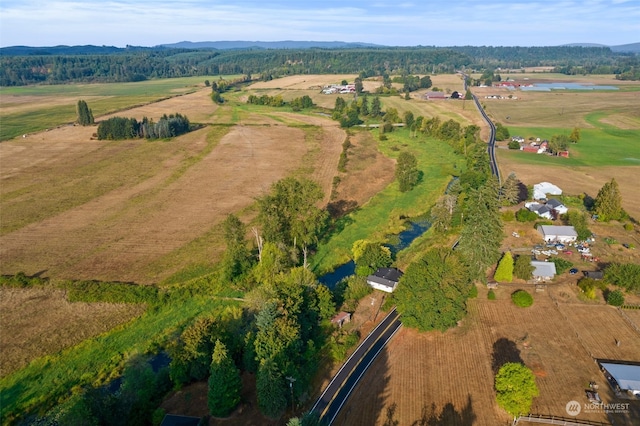 drone / aerial view featuring a water view and a rural view