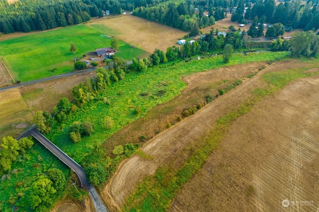 birds eye view of property with a rural view