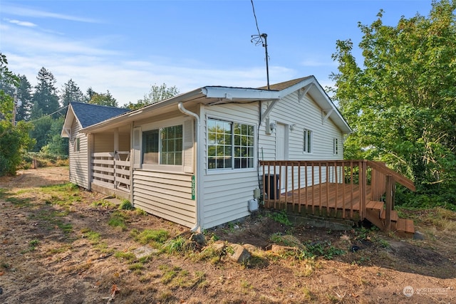 view of home's exterior with a deck