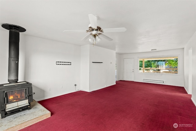 carpeted living room with ceiling fan, a baseboard heating unit, and a wood stove