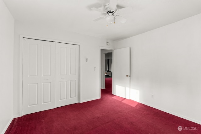 unfurnished bedroom featuring ceiling fan, a closet, and carpet