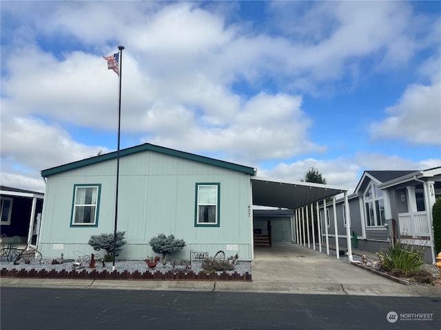 view of side of property featuring a carport