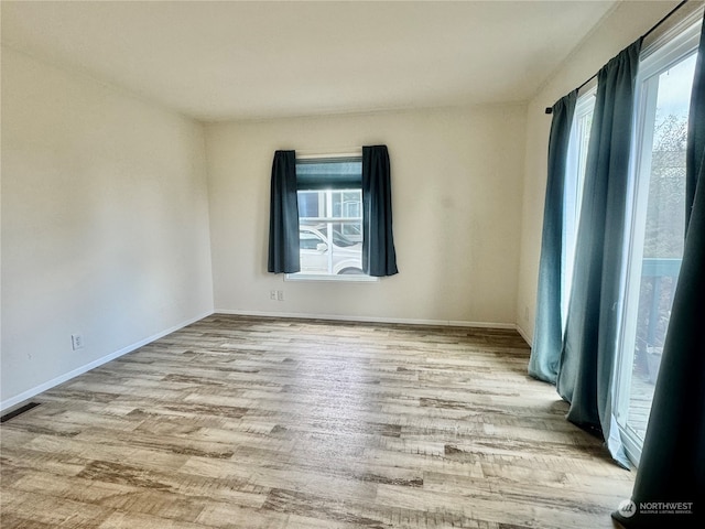 empty room with light wood-type flooring