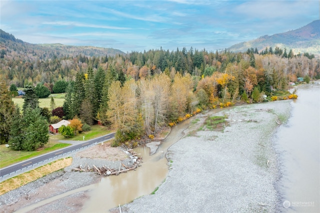 bird's eye view with a water and mountain view