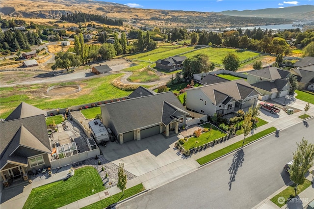 birds eye view of property with a mountain view