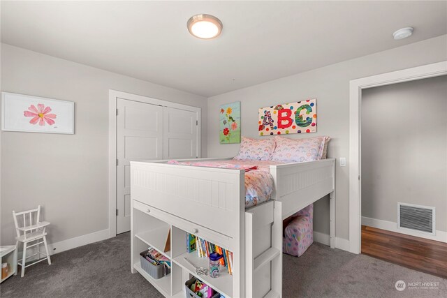 bedroom featuring dark carpet