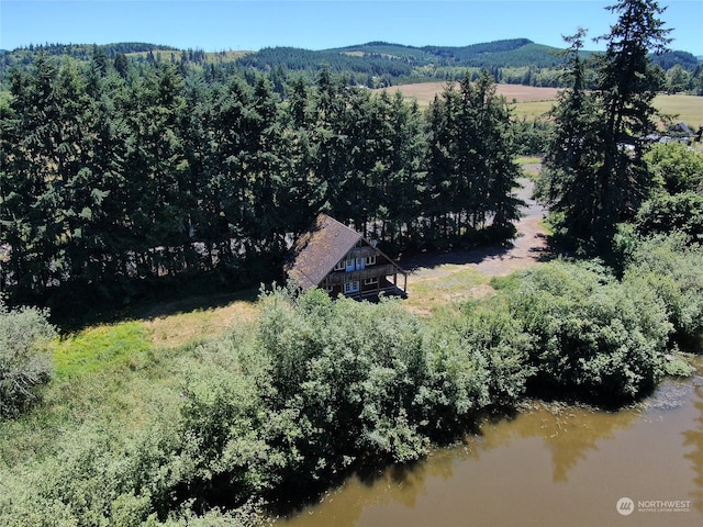 drone / aerial view with a water and mountain view