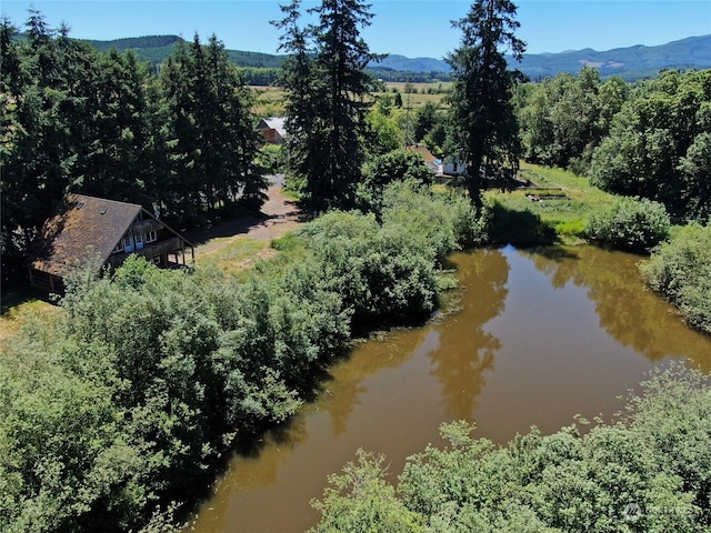 aerial view featuring a water and mountain view