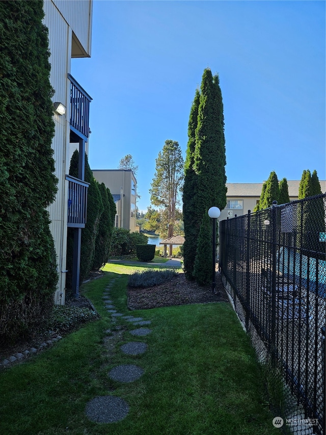 31003 14th Ave S Unit E-10, Federal Way, WA 98003 - view of yard with a balcony