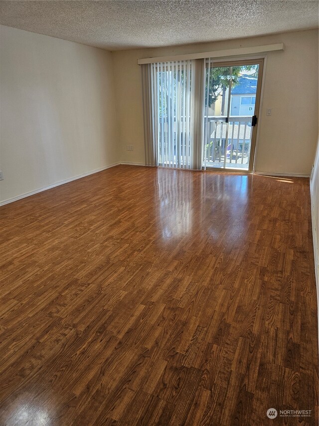31003 14th Ave S Unit E-10, Federal Way, WA 98003 - spare room with dark hardwood / wood-style floors and a textured ceiling