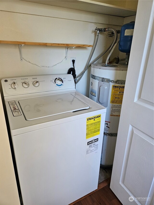 31003 14th Ave S Unit E-10, Federal Way, WA 98003 - laundry room featuring dark wood-type flooring, washer / clothes dryer, and secured water heater