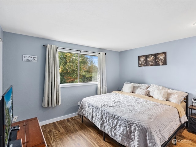 bedroom featuring hardwood / wood-style flooring