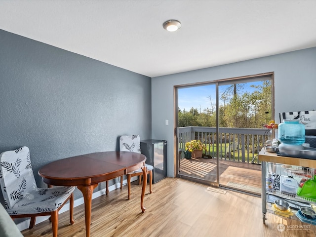 dining space featuring light hardwood / wood-style flooring