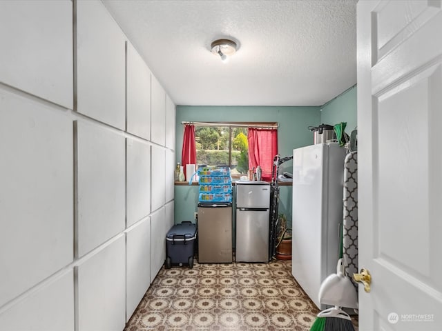 washroom with a textured ceiling