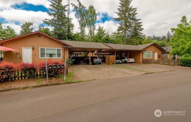 ranch-style home with a carport