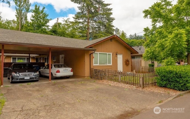 ranch-style home featuring a carport