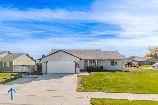 single story home with a garage and a front lawn