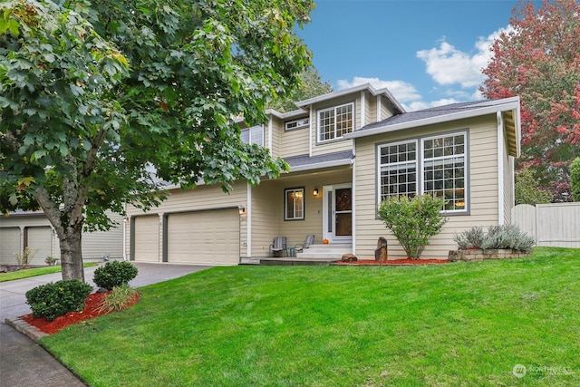 view of front of property featuring a front lawn and a garage