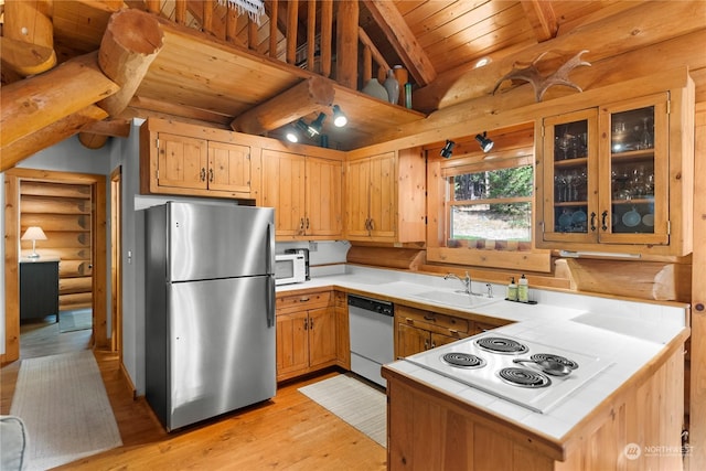 kitchen featuring log walls, white appliances, tile counters, wooden ceiling, and a sink