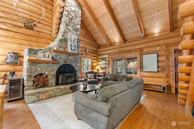 living area with wood ceiling, beam ceiling, wood-type flooring, rustic walls, and wine cooler