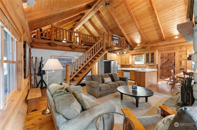 living area featuring vaulted ceiling with beams, wood ceiling, stairway, and light wood-style floors