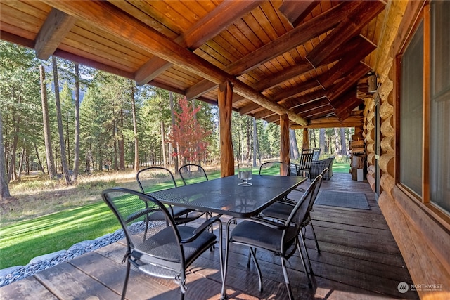 wooden deck featuring a yard