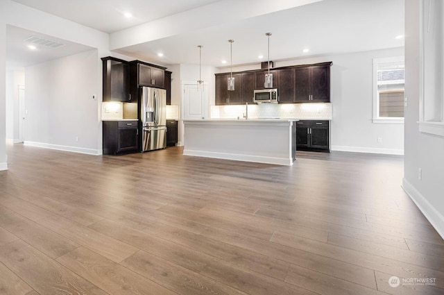 unfurnished living room featuring light hardwood / wood-style floors