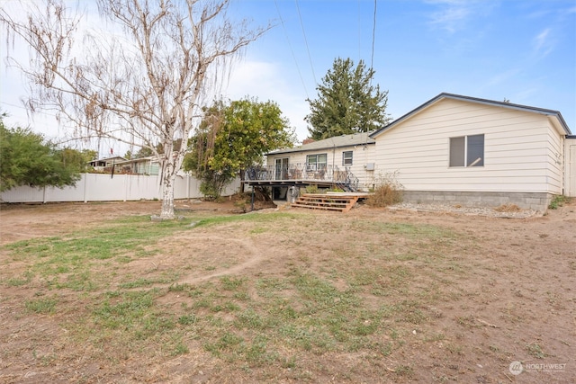 rear view of house with a deck