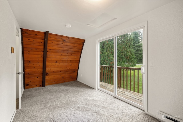 spare room with a baseboard radiator and carpet