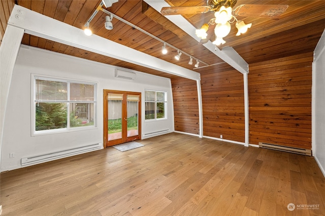 interior space featuring rail lighting, a baseboard radiator, a wall unit AC, and wooden ceiling