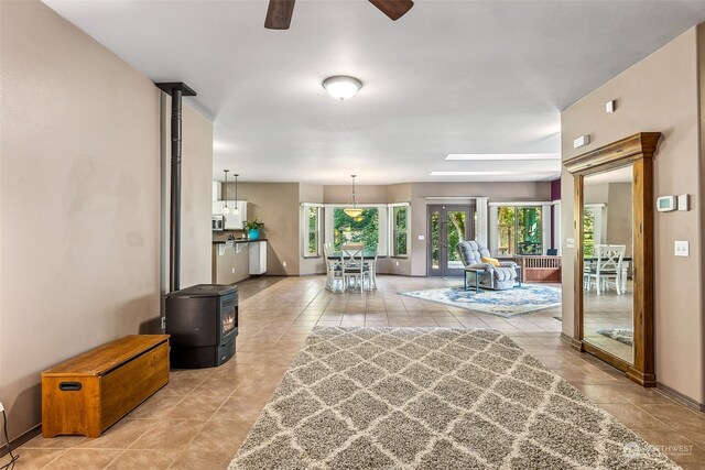 tiled living room with ceiling fan