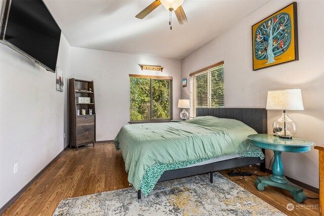 bedroom featuring dark hardwood / wood-style flooring and ceiling fan