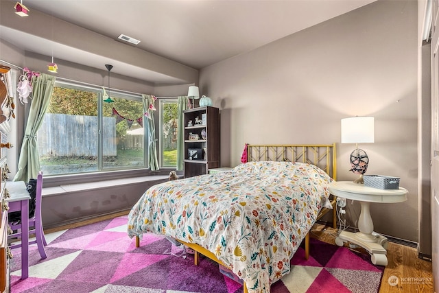 bedroom featuring wood-type flooring