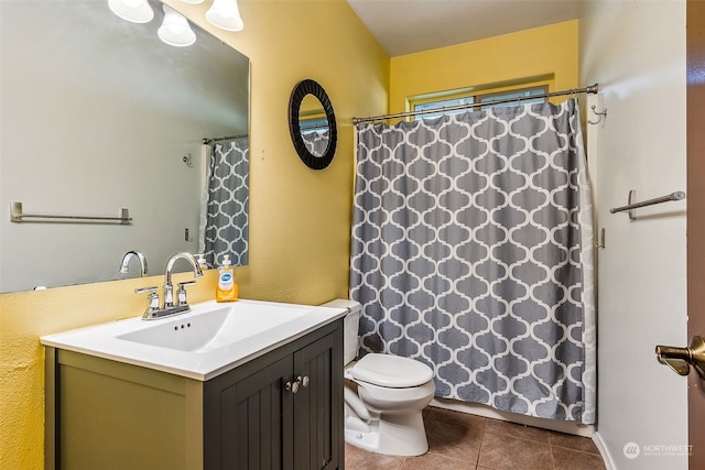 bathroom featuring tile patterned floors, toilet, vanity, and curtained shower