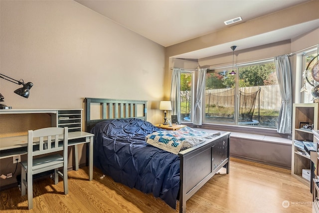 bedroom with light hardwood / wood-style flooring