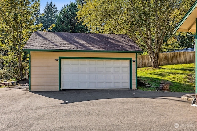 garage featuring a lawn