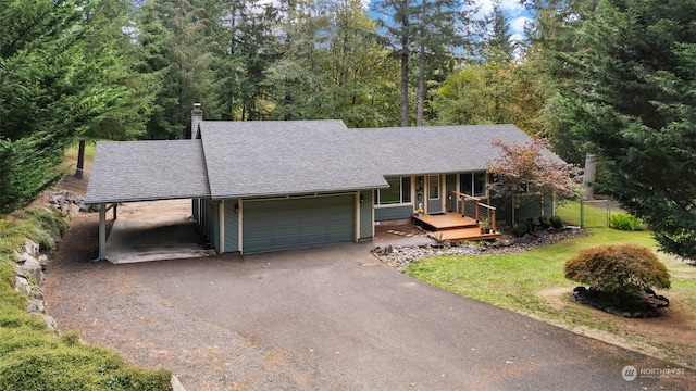 view of front of home with a front lawn and a garage