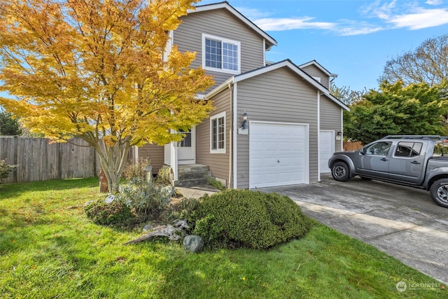 view of side of home with a lawn and a garage