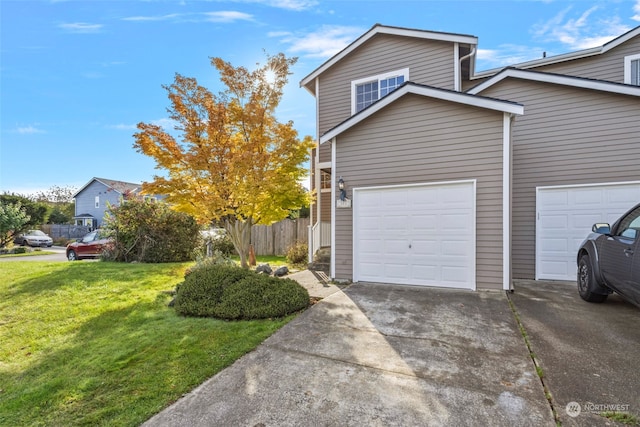 view of side of home with a yard and a garage