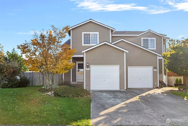 view of property featuring a front yard and a garage