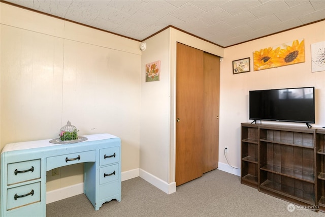 office featuring light colored carpet and ornamental molding