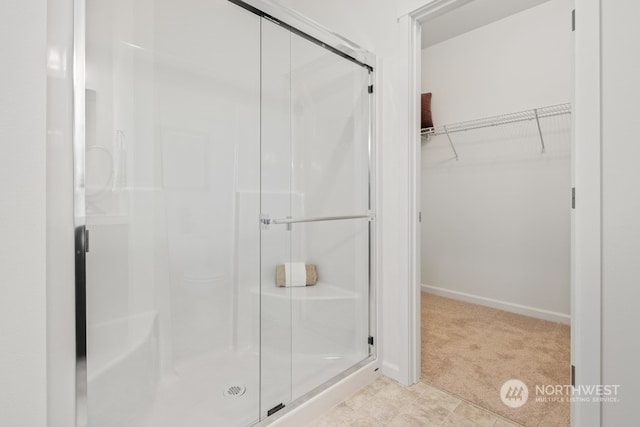 bathroom with a shower with shower door