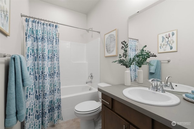 full bathroom featuring vanity, shower / bath combo, and toilet