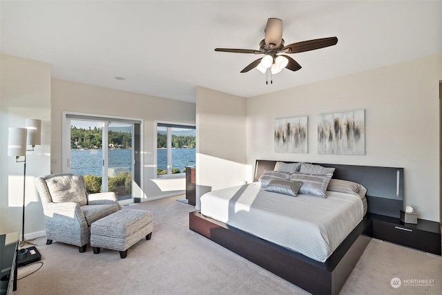 1558 Fairview St, Bellingham, WA 98229 - carpeted bedroom featuring access to outside, ceiling fan, baseboards, and a water view