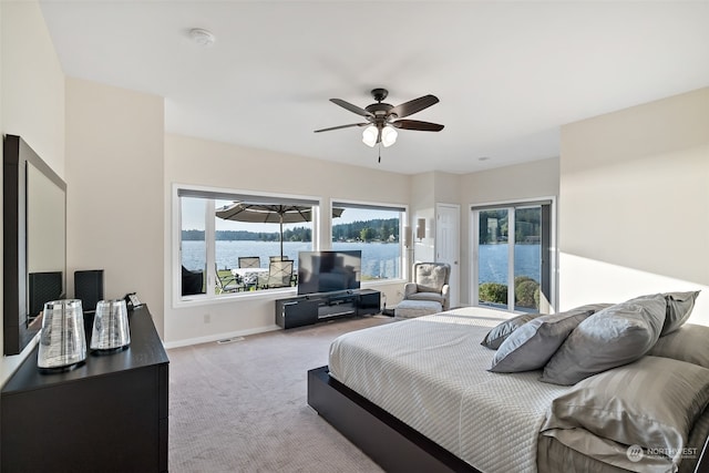 bedroom featuring ceiling fan and light carpet