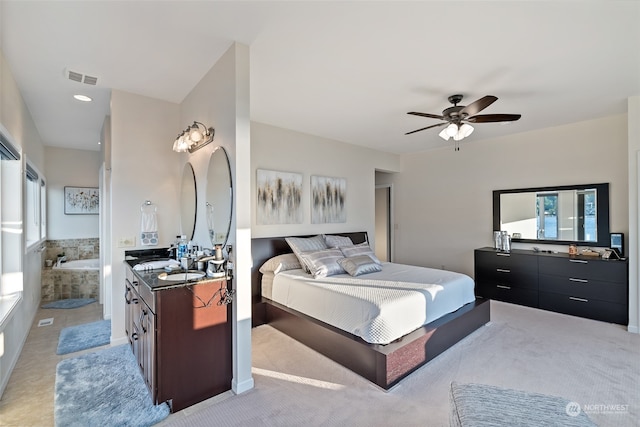 bedroom featuring light carpet and ceiling fan